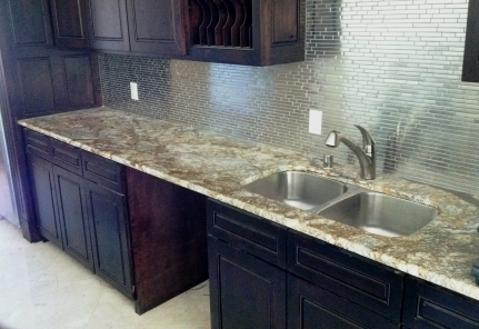 Artistic Gold Counertops, Stainless Backsplash - Dallas Remodelers